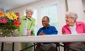 Elderly people painting with watercolors